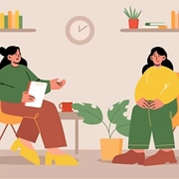 Terapeuta y paciente en sesión de terapia, sentadas frente a frente en consultorio acogedor con plantas.